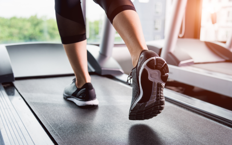 Woman running on a treadmill at the gym.
